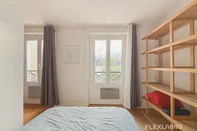 Un ou plusieurs lits dans un hébergement de l'établissement Flexliving - One bedroom - Houdon