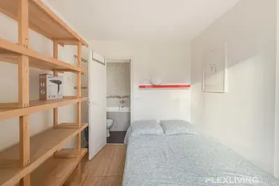 Un ou plusieurs lits dans un hébergement de l'établissement Flexliving - One bedroom - Houdon