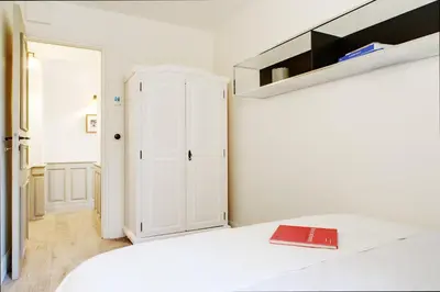 Un ou plusieurs lits dans un hébergement de l'établissement Paris Green House residence