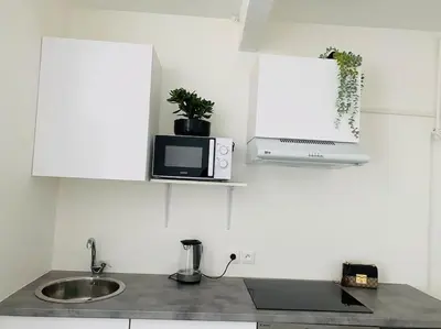 Cuisine ou kitchenette dans l'établissement Lovely apartment living room and bedroom near Eiffel Tower UNESCO