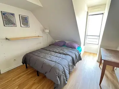 Un ou plusieurs lits dans un hébergement de l'établissement 3 chambres terrasse et parking gratuit