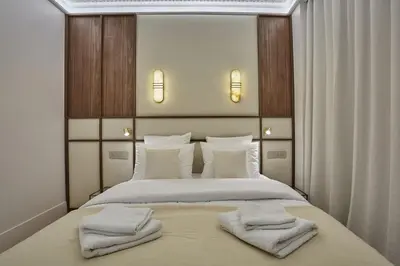 Un ou plusieurs lits dans un hébergement de l'établissement Apartment Matignon St Honore by Studio Prestige