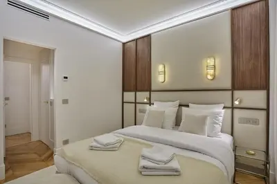 Un ou plusieurs lits dans un hébergement de l'établissement Apartment Matignon St Honore by Studio Prestige
