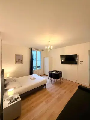 Un ou plusieurs lits dans un hébergement de l'établissement Appartement Monthiers Paris