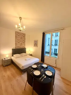 Un ou plusieurs lits dans un hébergement de l'établissement Appartement Monthiers Paris