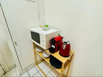 Cuisine ou kitchenette dans l'établissement Appartement Monthiers Paris