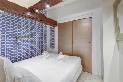 Un ou plusieurs lits dans un hébergement de l'établissement Paris Maison Lombards Terrasse