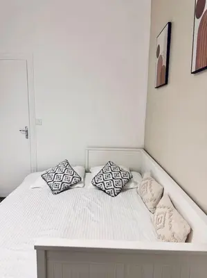 Un ou plusieurs lits dans un hébergement de l'établissement Studio cosy à Porte de Versailles