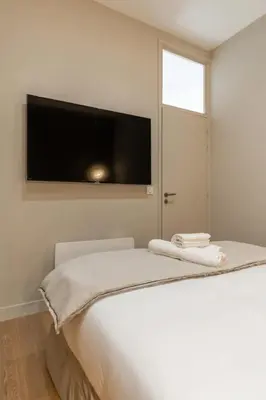 Un ou plusieurs lits dans un hébergement de l'établissement Splendide appartement de luxe Saint-Germain