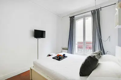 Un ou plusieurs lits dans un hébergement de l'établissement Lovely 1BR - 4P - Montmartre - Sacre coeur