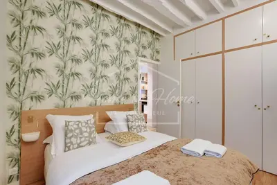 Un ou plusieurs lits dans un hébergement de l'établissement Le Marais Luxury & Charm 70m of Design