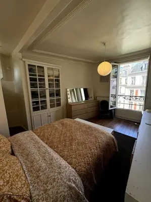 Un ou plusieurs lits dans un hébergement de l'établissement Grand loft Montmartre