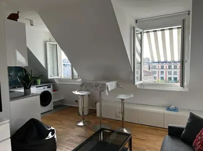 Coin salon dans l'établissement Apartment Paris Bail Mobility