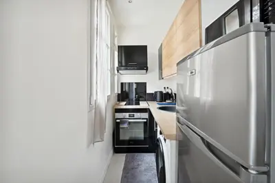 Cuisine ou kitchenette dans l'établissement Le Studaunien - Studio à 7min de Paris