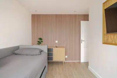 Coin salon dans l'établissement Nice Apartment with amazing view of Paris with private Parking