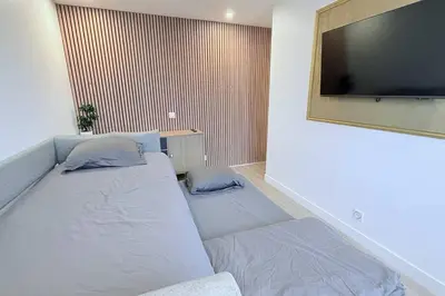 Un ou plusieurs lits dans un hébergement de l'établissement Nice Apartment with amazing view of Paris with private Parking