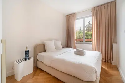 Un ou plusieurs lits dans un hébergement de l'établissement Luxury apartment on Canal Saint Martin