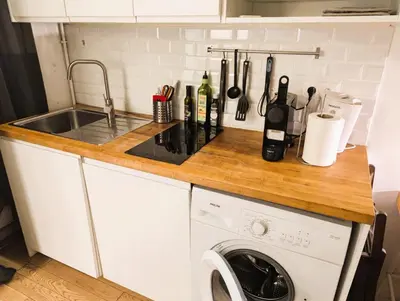 Cuisine ou kitchenette dans l'établissement Cozy Nest - Montmartre Caulaincourt