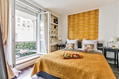 Un ou plusieurs lits dans un hébergement de l'établissement Charming 1BR apartment with terrace Le Marais Paris Center