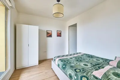 Un ou plusieurs lits dans un hébergement de l'établissement Appartement 10 min de paris bien desservi-Métro 4
