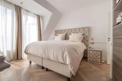 Un ou plusieurs lits dans un hébergement de l'établissement Palais Privé Luxe Vue Tour Eiffel Confort Exclusif