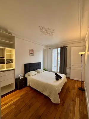 Un ou plusieurs lits dans un hébergement de l'établissement Appartement Tour Eiffel Lecourbe Paris