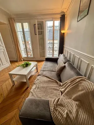 Coin salon dans l'établissement Appartement Tour Eiffel Lecourbe Paris