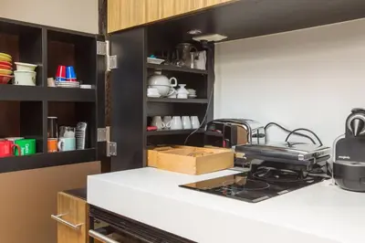 Cuisine ou kitchenette dans l'établissement Small Triplex