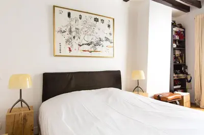 Un ou plusieurs lits dans un hébergement de l'établissement Small Triplex