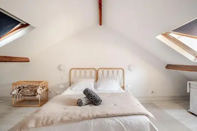 Un ou plusieurs lits dans un hébergement de l'établissement Duplex spacieux, 10 min de Paris