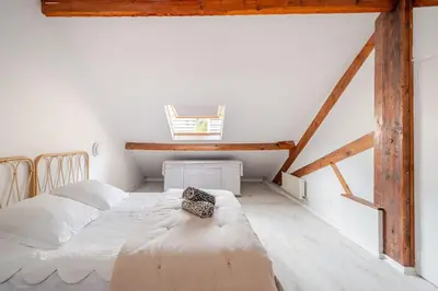 Un ou plusieurs lits dans un hébergement de l'établissement Duplex spacieux, 10 min de Paris