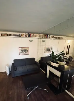 Coin salon dans l'établissement Charmant Studio BASTILLE - Votre Havre de Paix au Cœur de Paris !