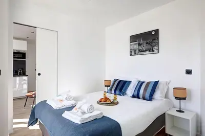 Un ou plusieurs lits dans un hébergement de l'établissement Suite Par ici - Superbe appartement