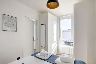 Un ou plusieurs lits dans un hébergement de l'établissement Suite Par ici - Superbe appartement