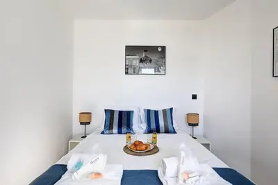 Un ou plusieurs lits dans un hébergement de l'établissement Suite Par ici - Superbe appartement