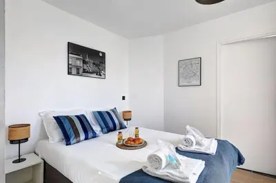 Un ou plusieurs lits dans un hébergement de l'établissement Suite Par ici - Superbe appartement