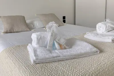 Un ou plusieurs lits dans un hébergement de l'établissement Suite Dolce Vita - Superbe Appartement