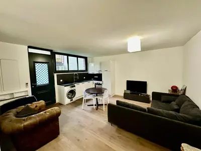 Coin salon dans l'établissement Charmant studio 37m2 Jardin privatif