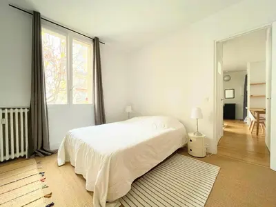 Un ou plusieurs lits dans un hébergement de l'établissement Charming Apartment, Paris Centre