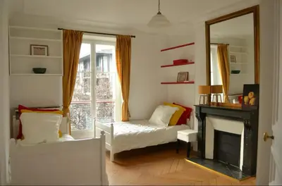 Un ou plusieurs lits dans un hébergement de l'établissement Appartement proche île saint Louis