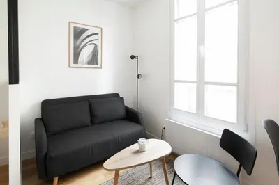 Coin salon dans l'établissement GuestReady - Cozy Parisian Escape for 2