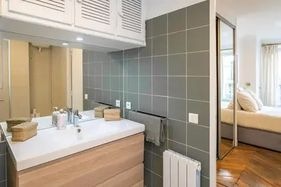 Un ou plusieurs lits dans un hébergement de l'établissement Appartement Haussmannien Étoile