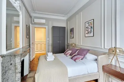 Un ou plusieurs lits dans un hébergement de l'établissement Élégant 2 chambres climatisé - Champs-Élysées