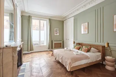 Un ou plusieurs lits dans un hébergement de l'établissement Élégant 2 chambres climatisé - Champs-Élysées