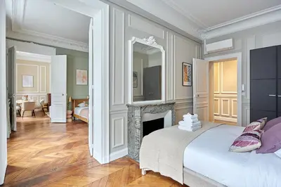 Un ou plusieurs lits dans un hébergement de l'établissement Élégant 2 chambres climatisé - Champs-Élysées