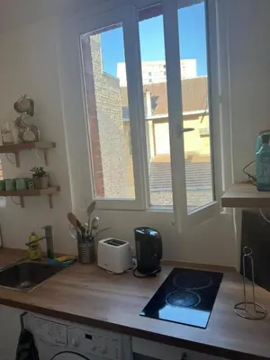 Cuisine ou kitchenette dans l'établissement Cosy Haven Paris 14