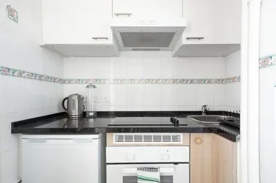 Cuisine ou kitchenette dans l'établissement Élégante Suite Haussmannienne au coeur du 6ème