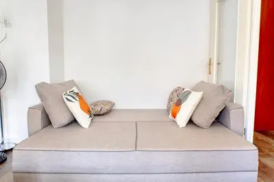 Coin salon dans l'établissement Appartement cosy parking privé