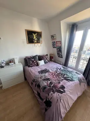 Un ou plusieurs lits dans un hébergement de l'établissement Appartement sous le toits de Paris