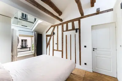 Un ou plusieurs lits dans un hébergement de l'établissement Appartement Place des Vosges, Marais Bastille
